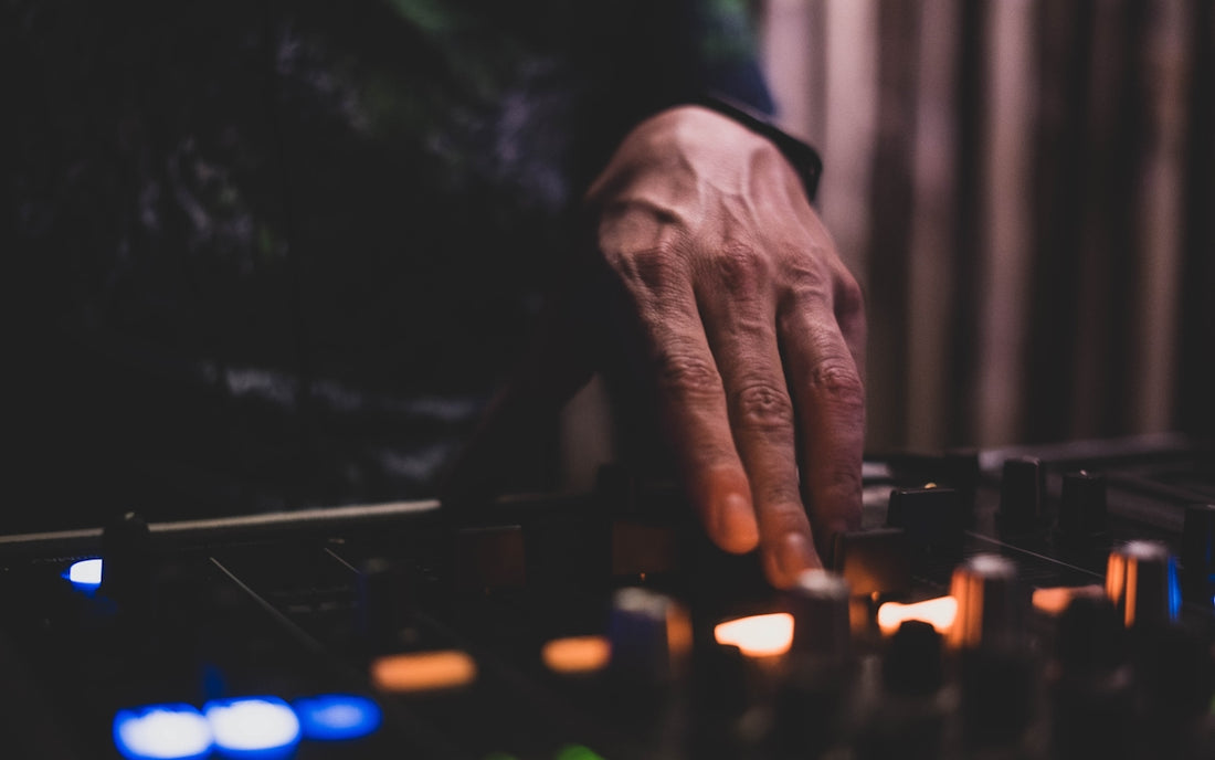 person playing chess with lighted candles